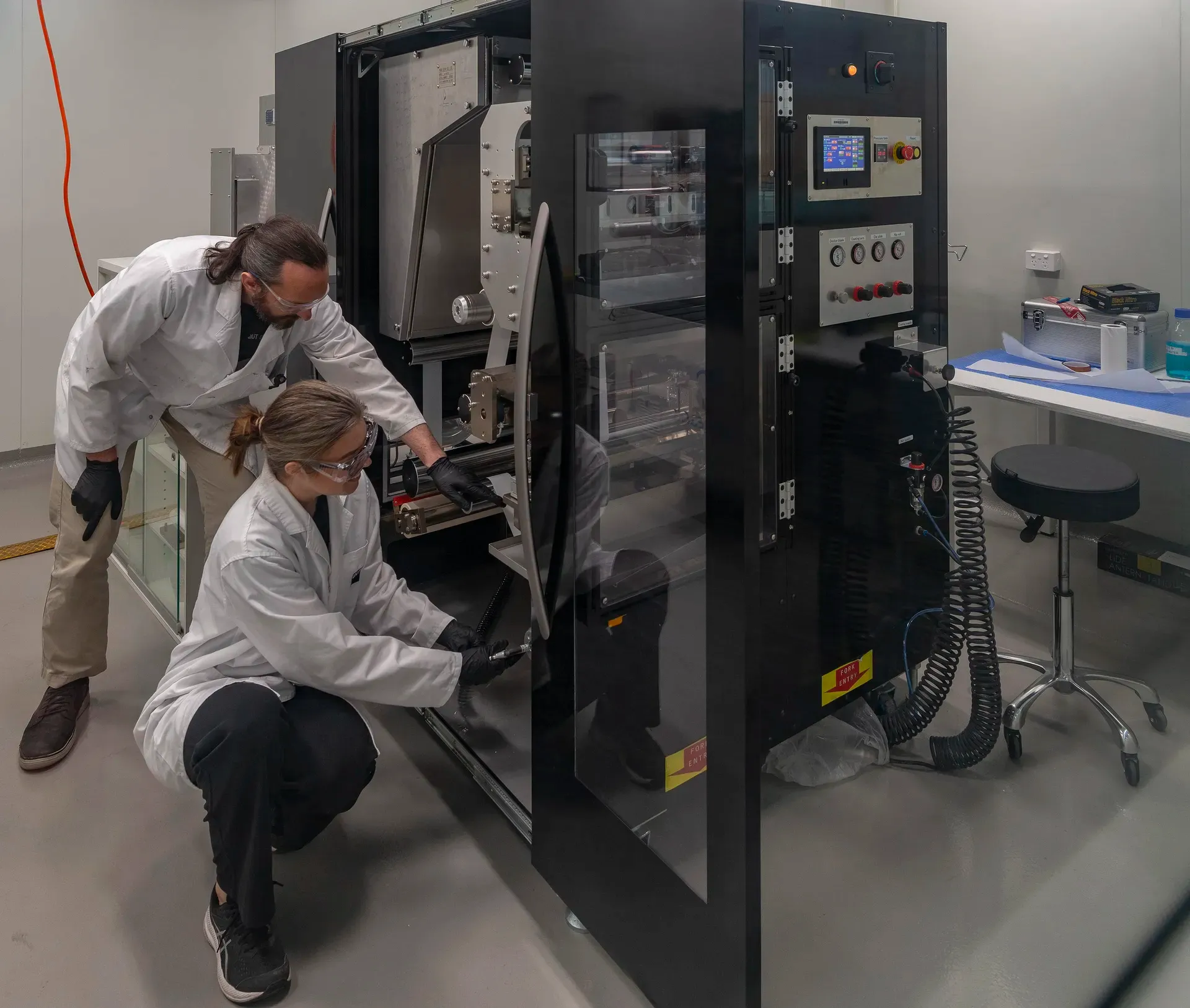 Researchers working inside the PRiSM laboratory
